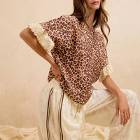 Leopard print top with lace-trimmed sleeves paired with cream striped shorts