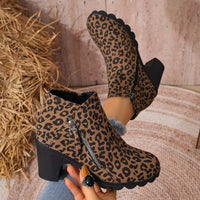 Leopard print ankle boots with round toe, block heel, and side zipper closure