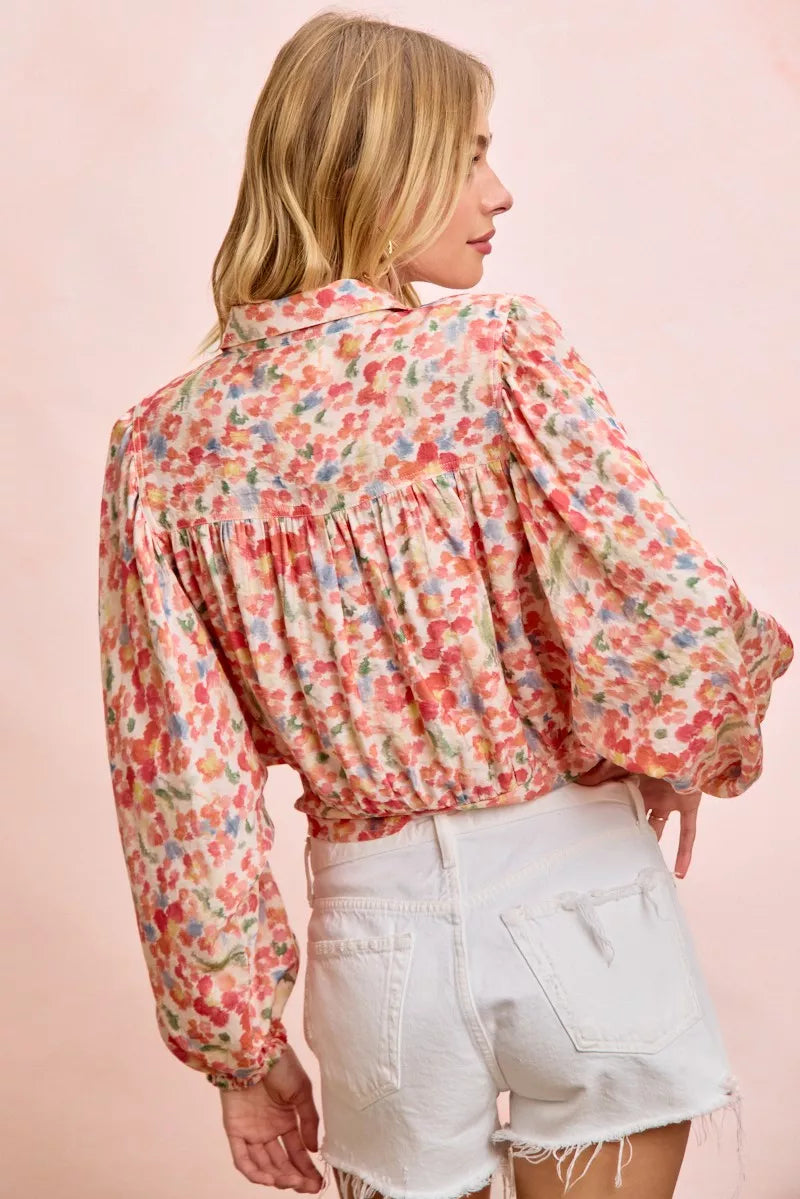 Floral print crop shirt back view with gathered tiers and tied hem