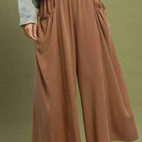 Brown flowy wide-leg pocket pants with gathered waistband and side pockets