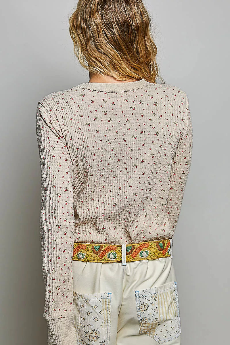 Back view of ribbed knit crew neck long-sleeve top with mini floral print