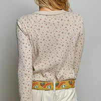 Back view of ribbed knit crew neck long-sleeve top with mini floral print
