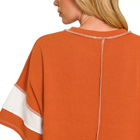Burnt orange striped terry top with exposed center back seam and short sleeve