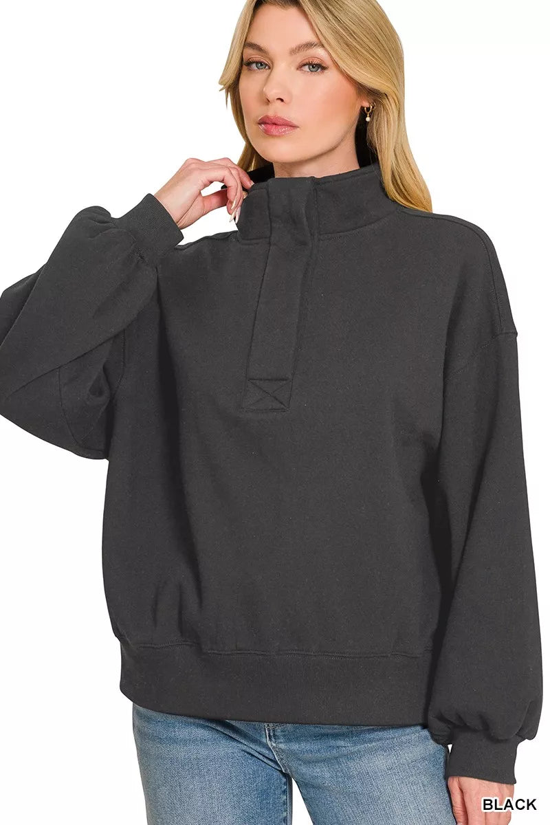Black fleece half-snap sweatshirt with half-button placket and tall collar