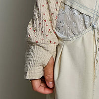 Long-sleeve knit top with ribbed cuff and mini floral print at side hem