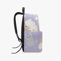 Kids purple kitten-print backpack angled view with black zipper pocket trim
