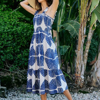 Smocked bodice tiered midi dress with navy abstract print, sleeveless, below-knee