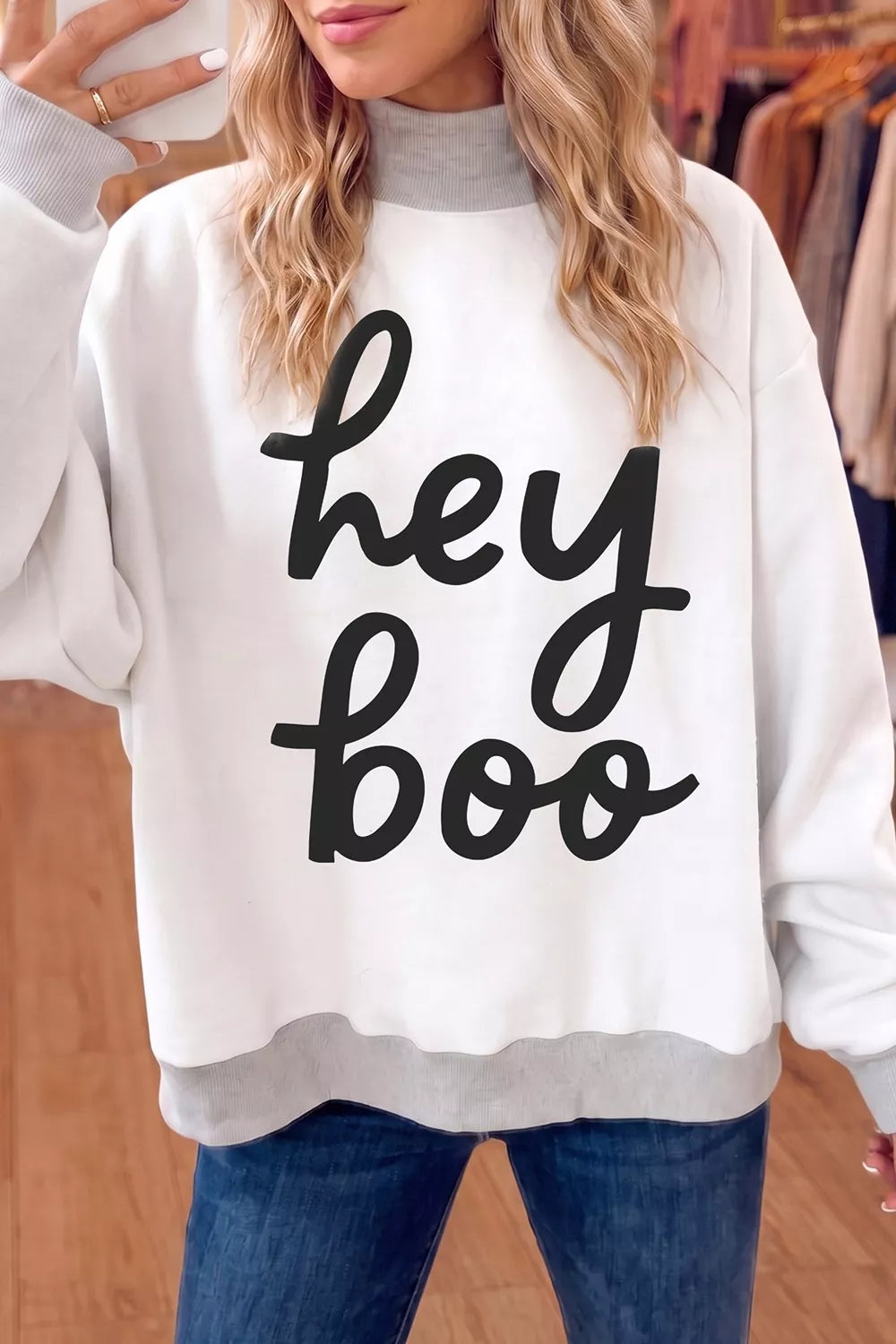 Reversible white mock neck tunic sweatshirt with "hey boo" black script front
