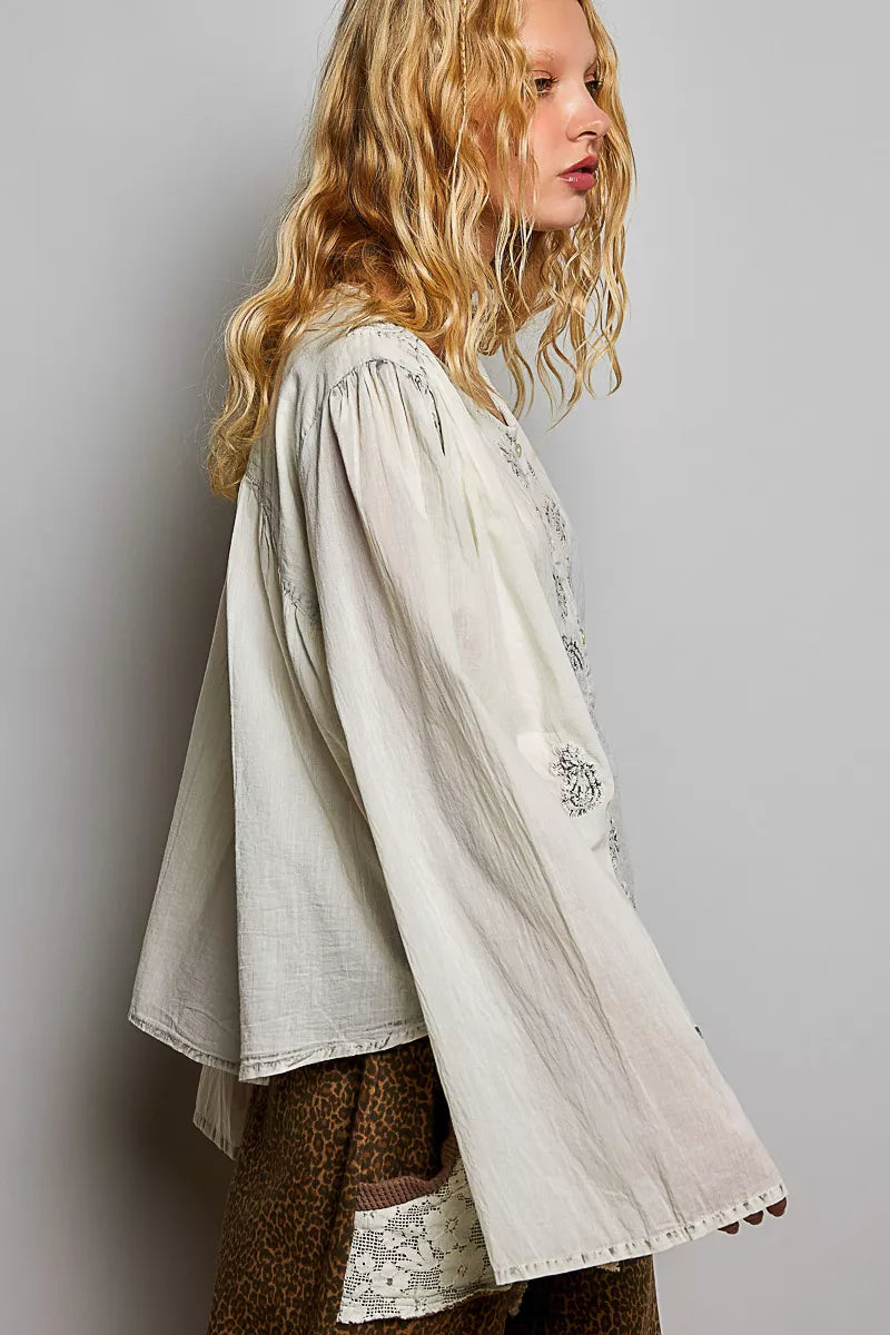 Pale grey embroidered button-front woven shirt with floral motifs, long loose sleeves