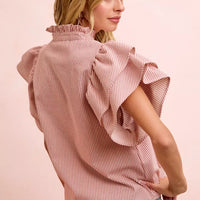 Women's red-and-white striped blouse with ruffle collar and tied back detail