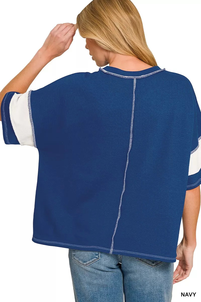 Navy French terry top, back view with exposed seam detail and short sleeves
