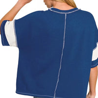 Navy French terry top, back view with exposed seam detail and short sleeves