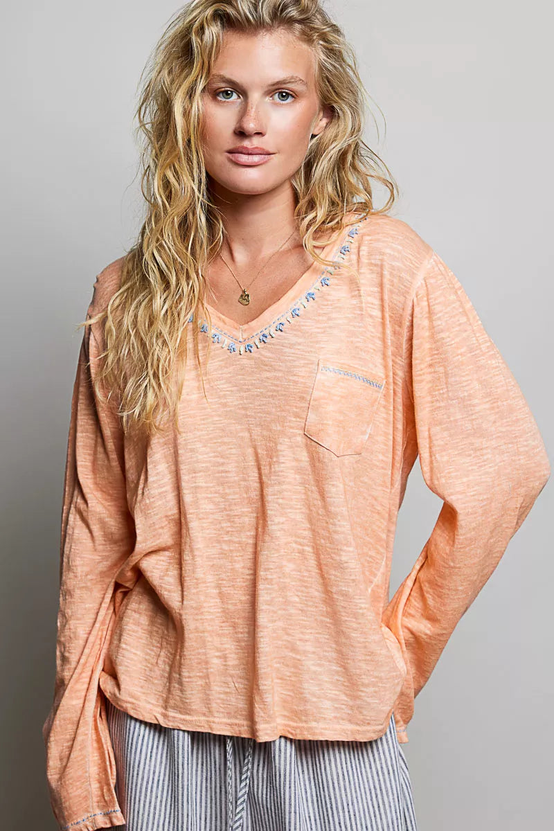 Peach V-neck lightweight knit long-sleeve top with contrast trim and chest pocket