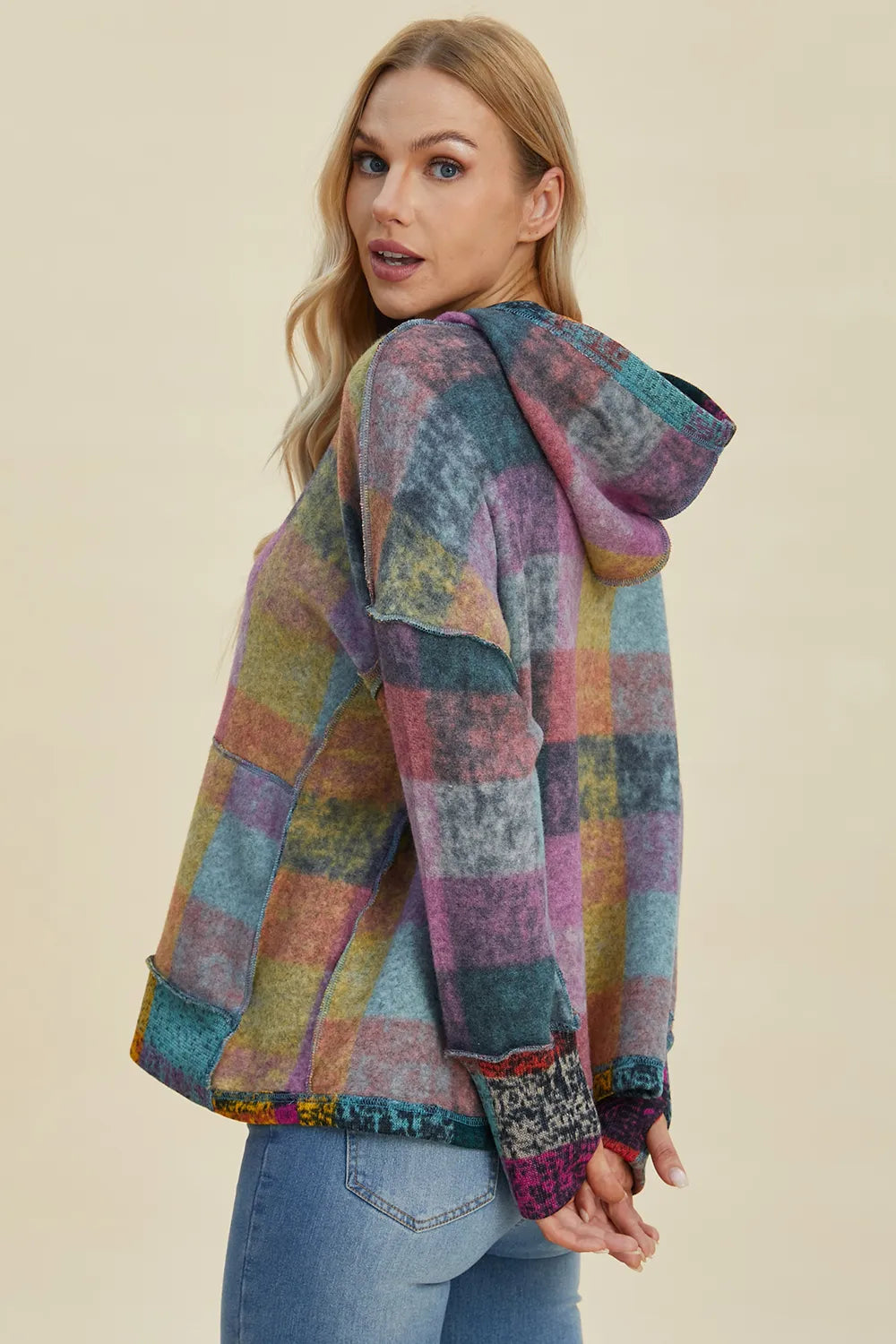 Multicolor plaid fleece hoodie with hood and quarter-zip placket, side view