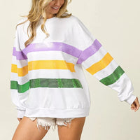 White sweatshirt with sequin-striped horizontal bands and long sleeves, side view