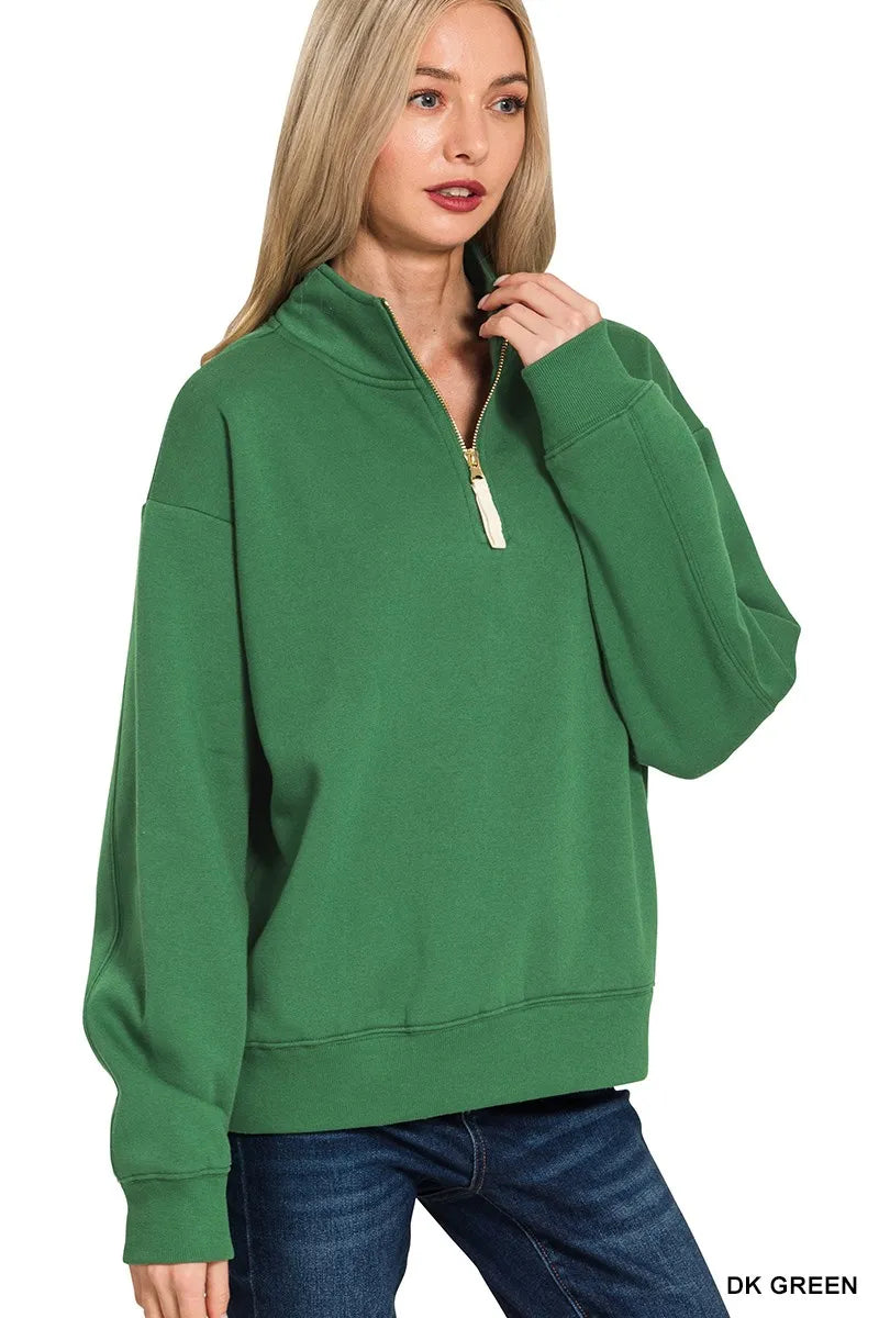 Dark green fleece half-zip pullover with long sleeves and front zip placket