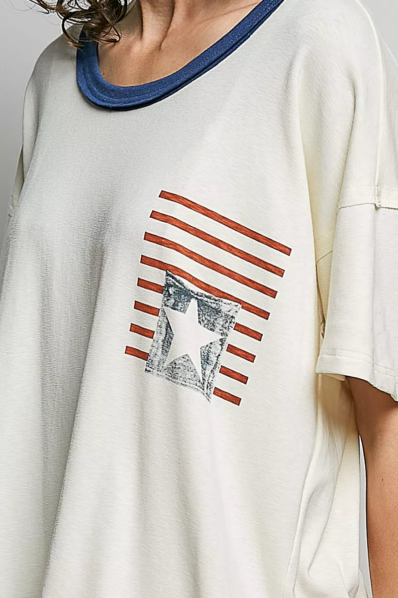 Cream cotton top close-up: blue neckline trim and American flag print with star