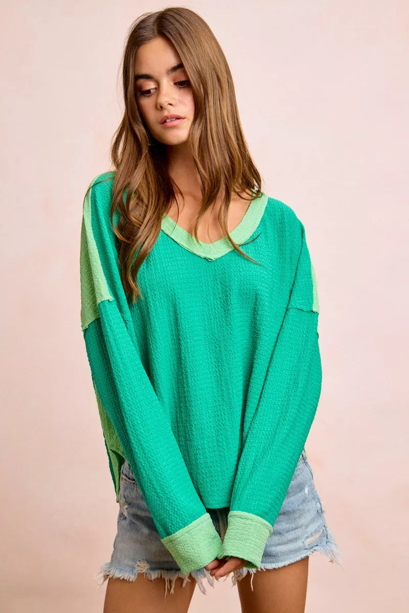 Textured jersey color block top, emerald green with light green sleeves and V-neck