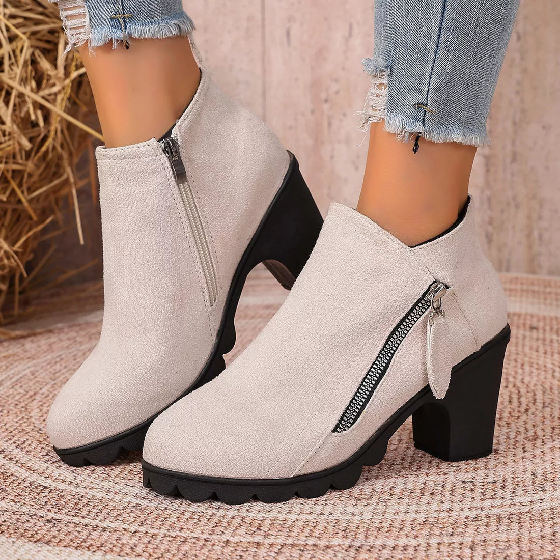 Light beige suede ankle boots with round toe, block heel, and side zipper