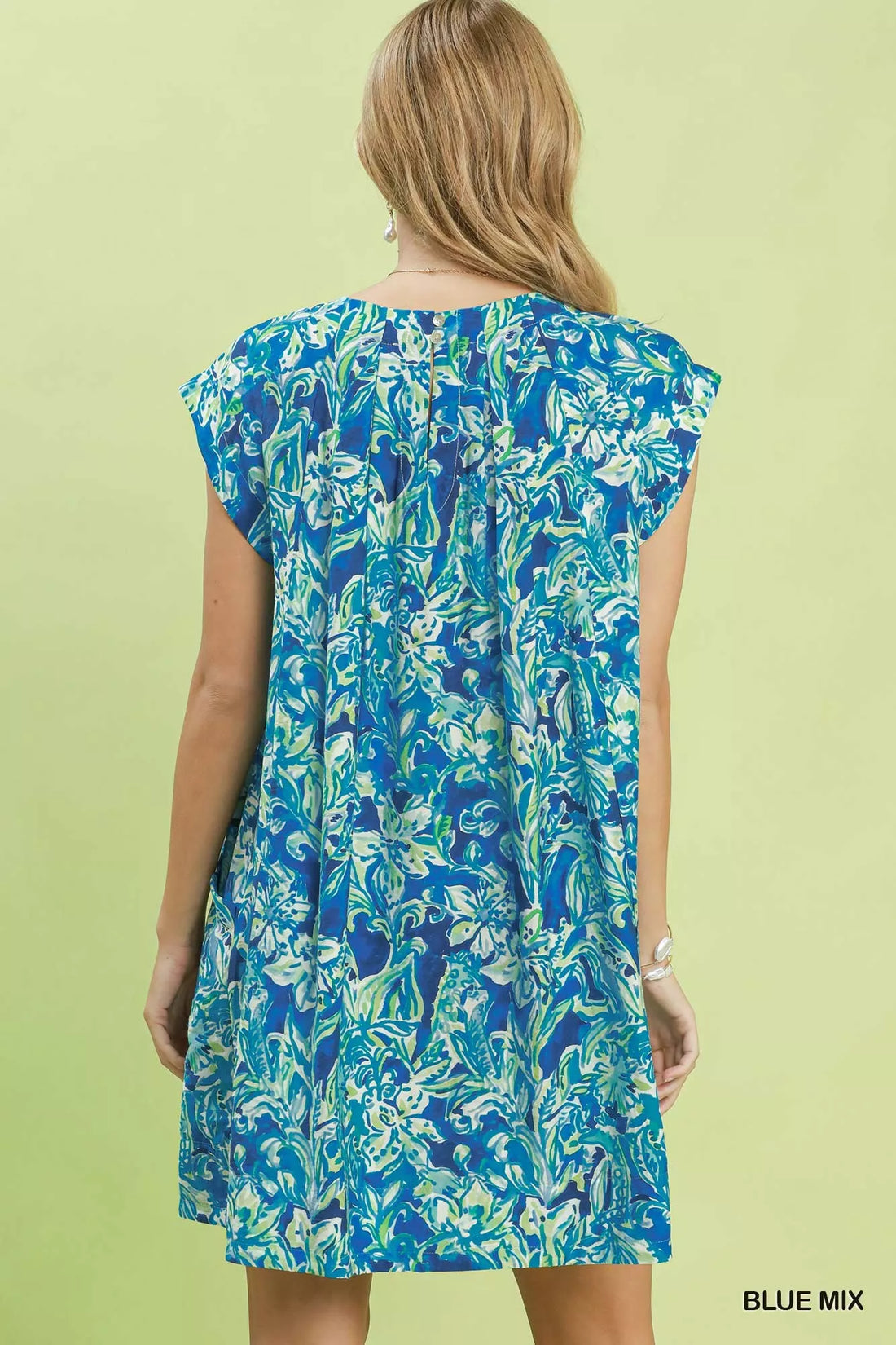Blue tropical floral swing dress back view with flutter sleeves