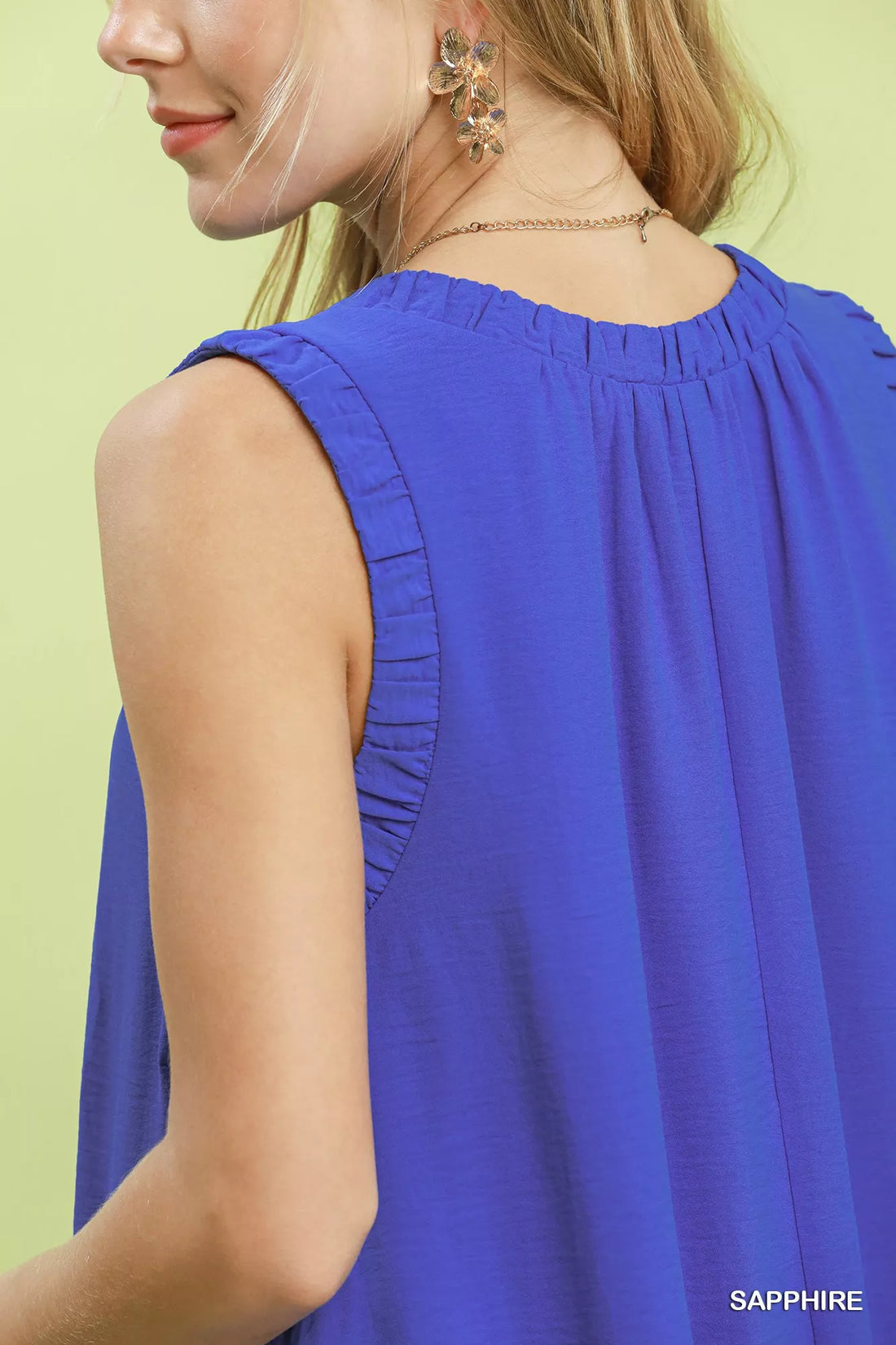 Sapphire blue sleeveless dress back detail with gathered yoke and pleats