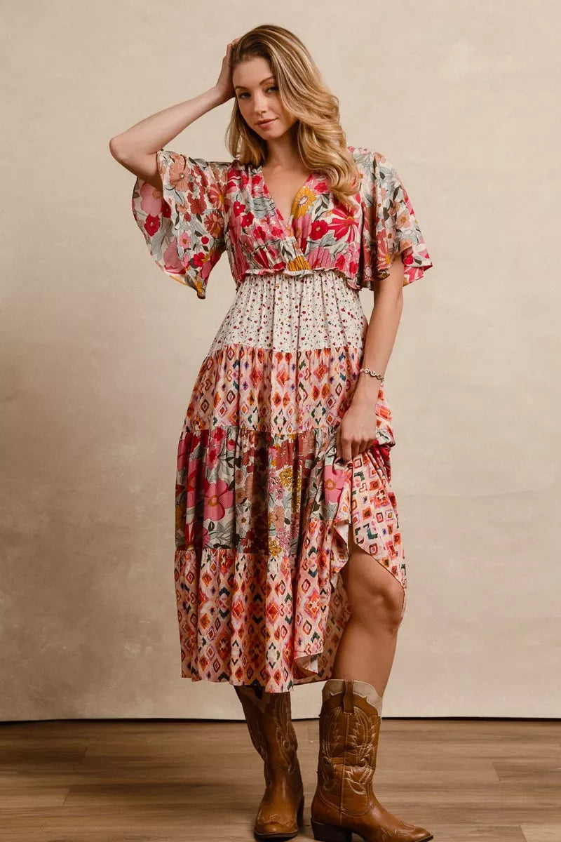 Floral print tiered midi dress with V-neck, short flutter sleeves, and ruffle waist