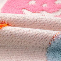 Dusty pink knit sweater with pumpkin pattern detail