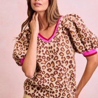 Leopard print puff-sleeve V-neck sweater with hot pink trim, side view