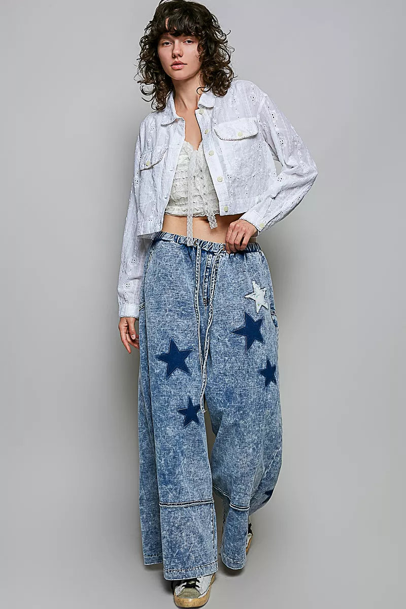Off white eyelet cotton cropped button-front jacket with long sleeves, front view