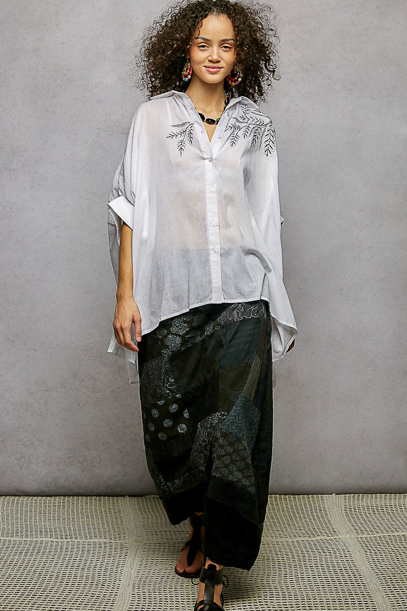 Ivory embroidered floral button-front shirt with draped silhouette and high-low hem