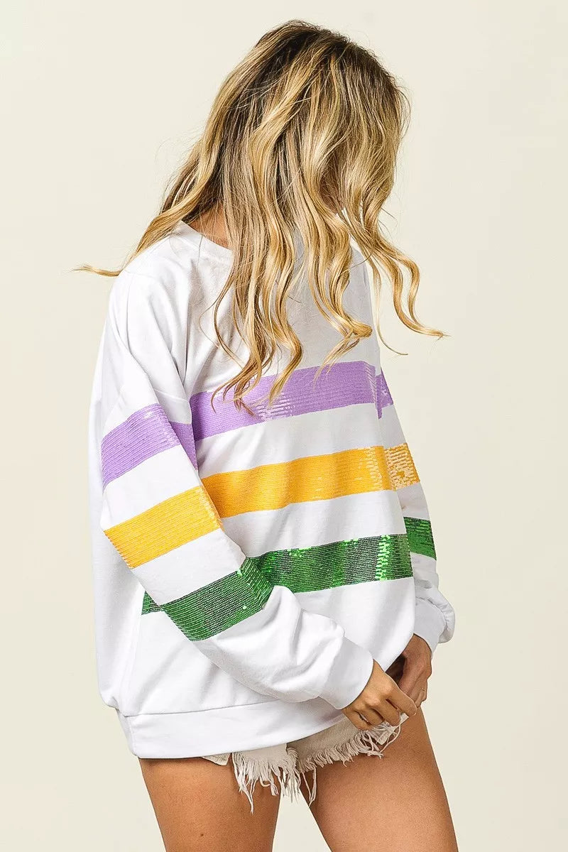 White sequin striped sweatshirt, back view with purple, yellow, and green bands
