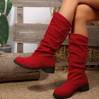 Red round-toe block heel boots with ruched shaft, side view