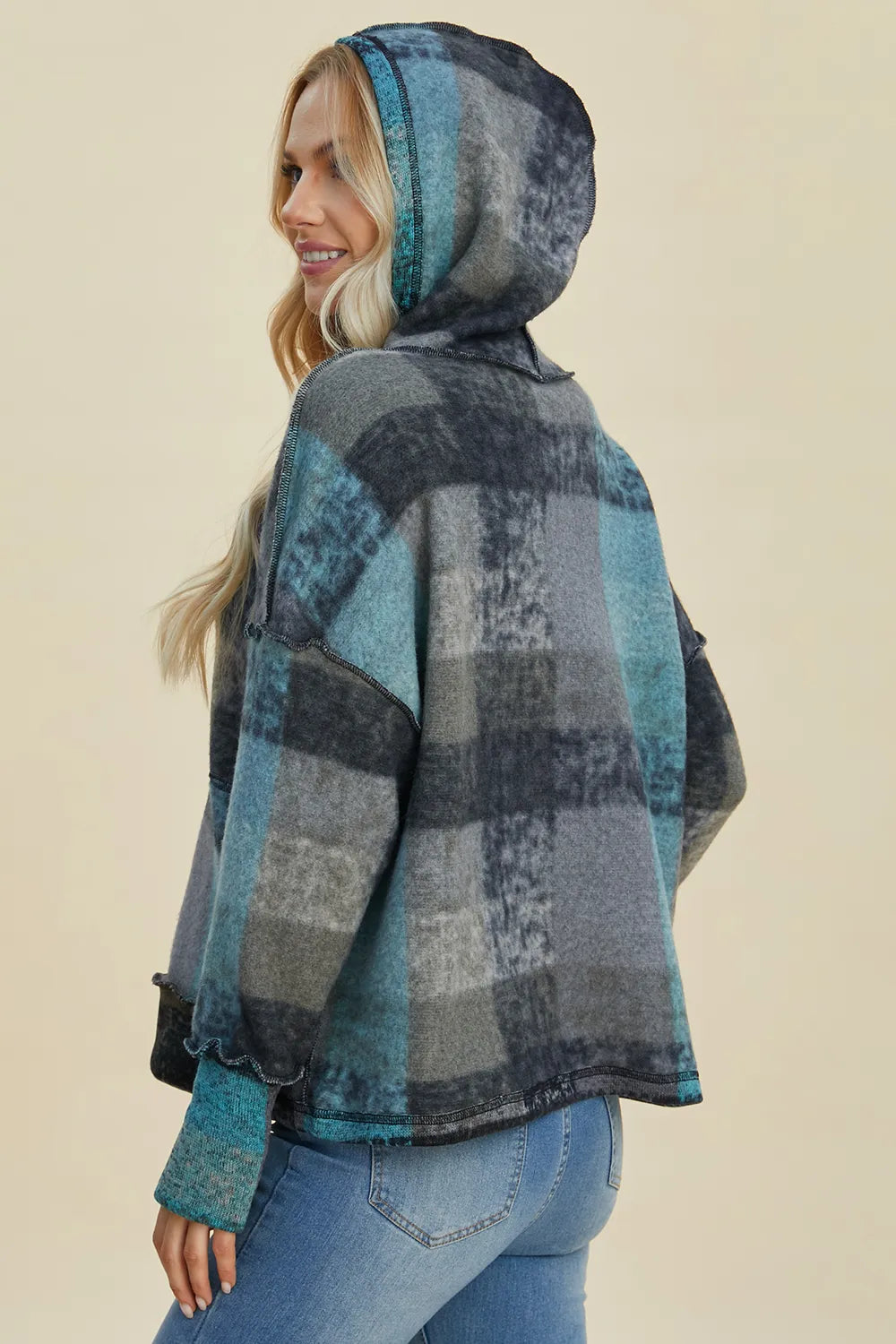 Plaid fleece hoodie with hood, half-zip, plaid blocks, back/side view.