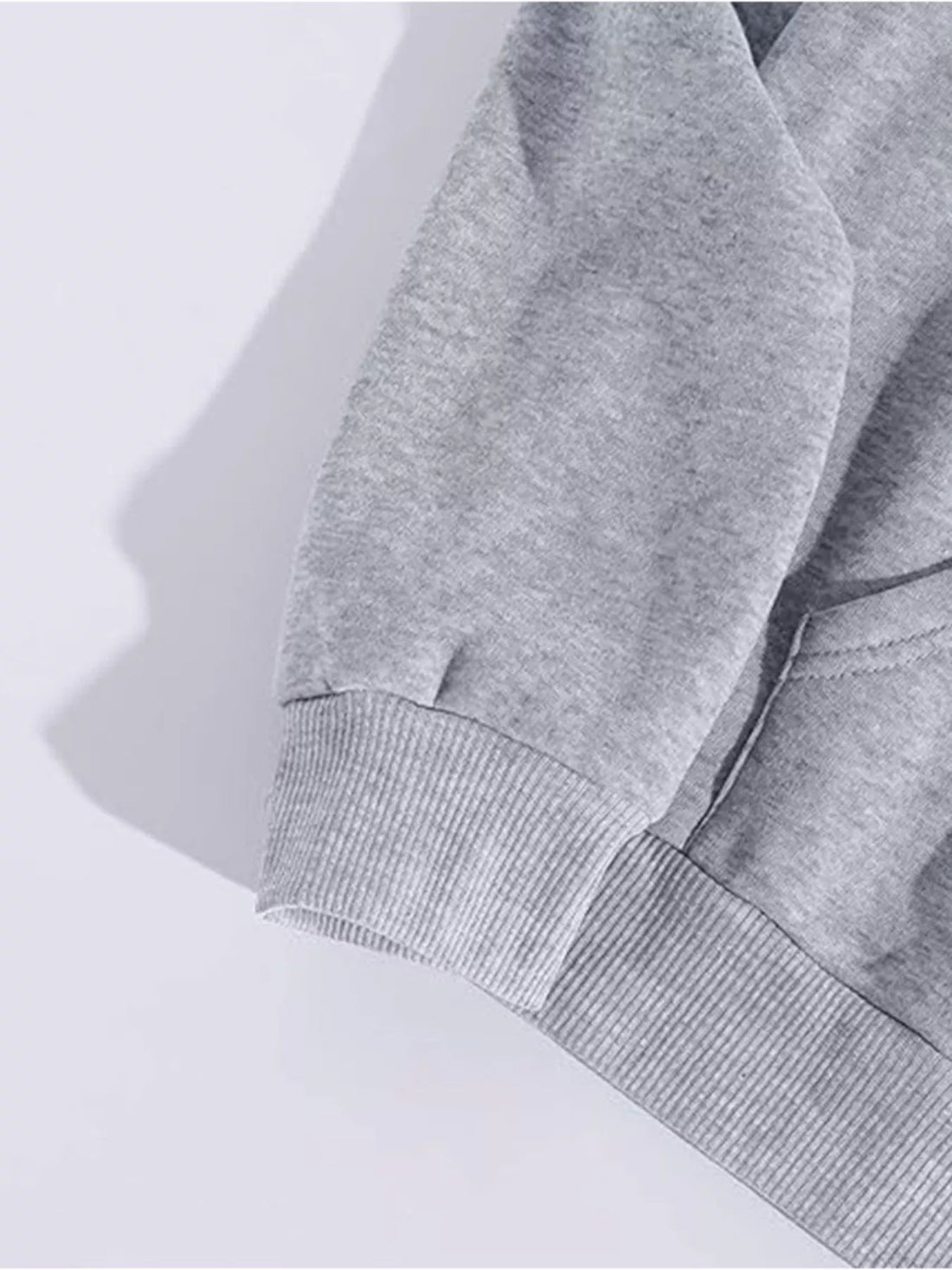 Light gray hoodie sleeve with ribbed cuff detail