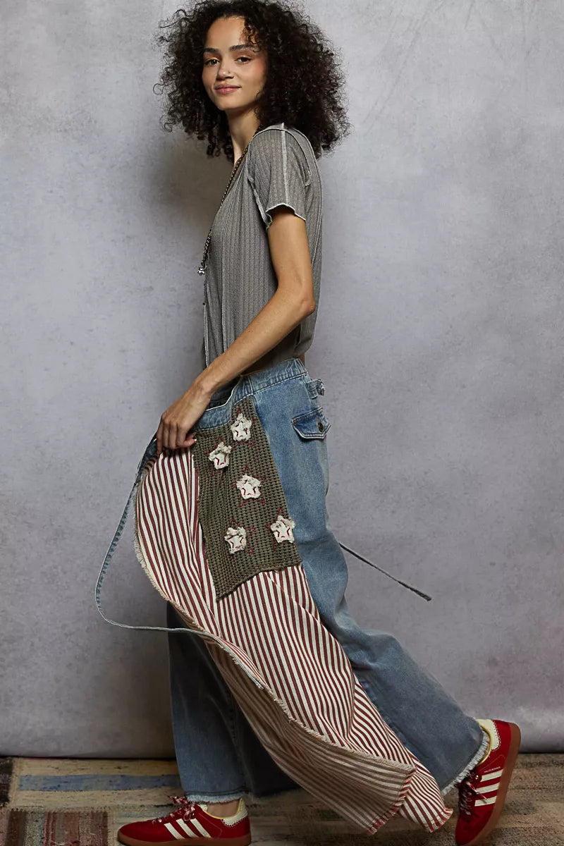 Grey pinstripe V-neck short sleeve top with stitch seam detail, side view