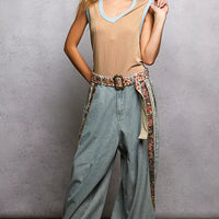 Mocha striped ribbed sleeveless tank with light blue V-neck contrast trim, full torso view