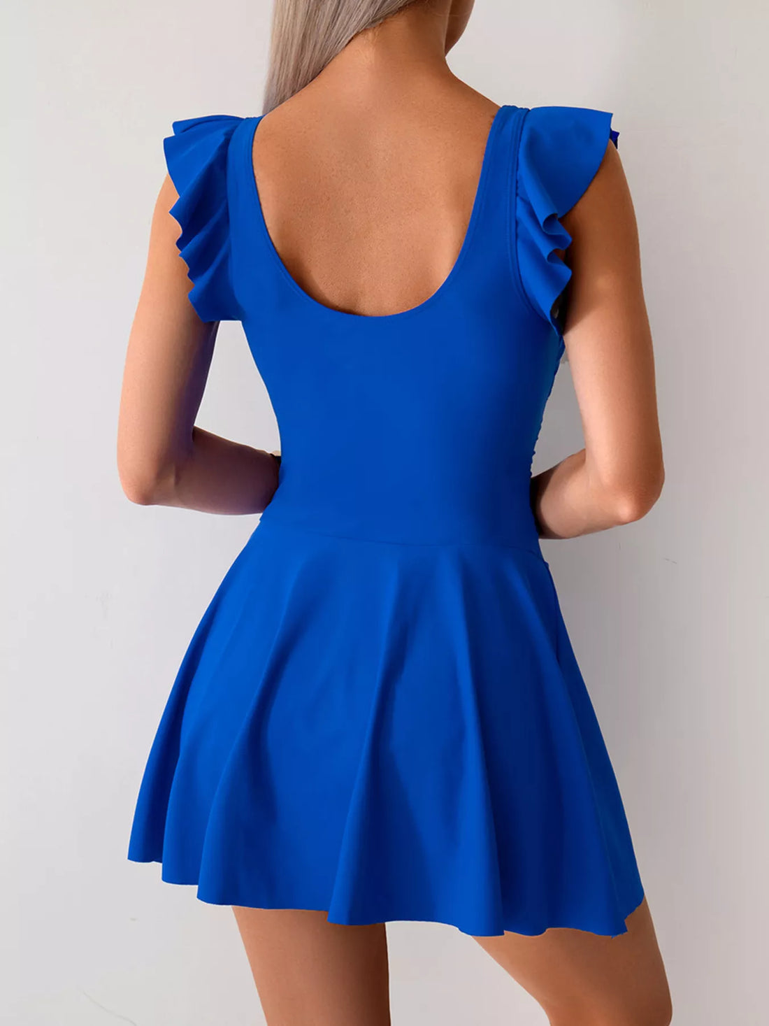 Royal blue ruffled-sleeve swim dress with scooped back and ruched waist bow