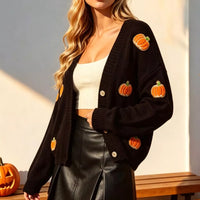 Black long-sleeve cardigan with V-neck, button front, and pumpkin patch buttons