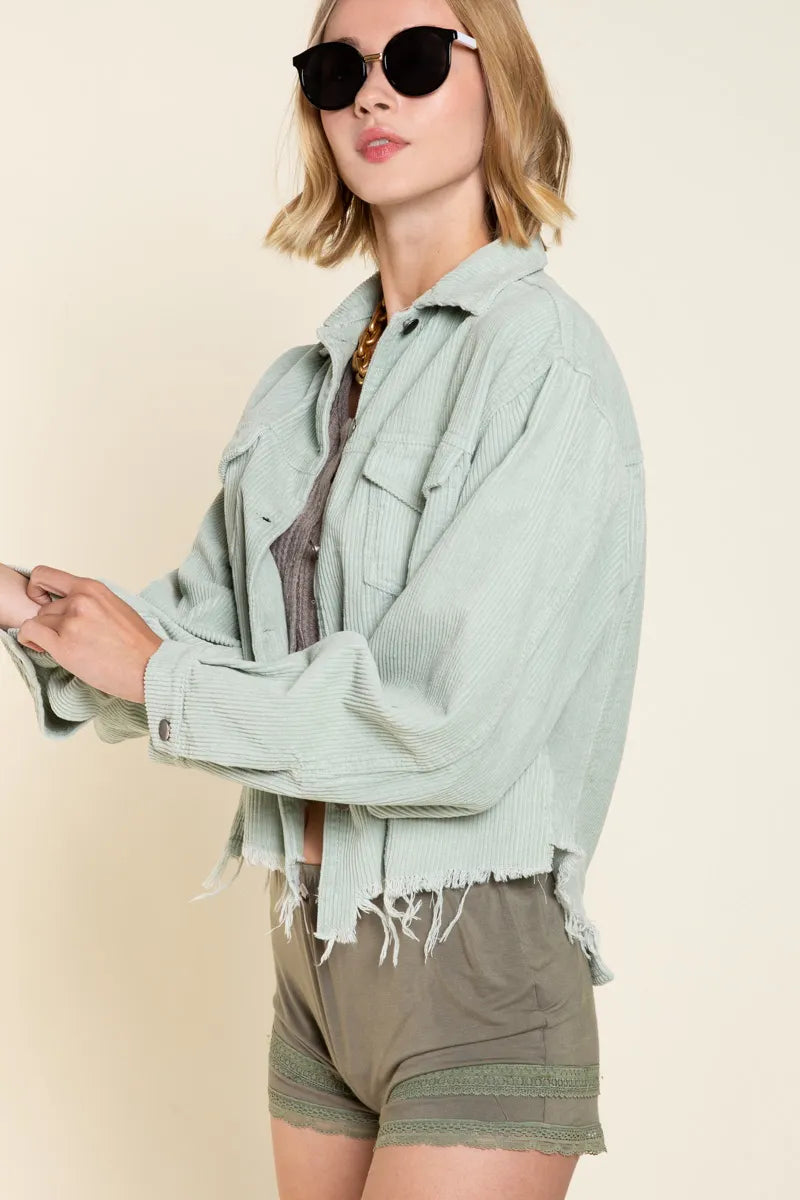Sage corduroy button-front trucker jacket with flap chest pockets, frayed cuffs and hem
