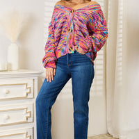 Multicolor v-neck cardigan with long sleeves and button-front, relaxed fit