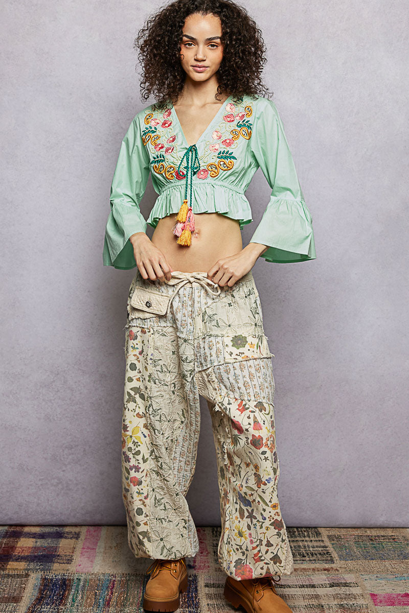 Mint floral embroidered cropped blouse with V-neck and tassel tie at waist