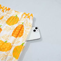 Printed lounge shorts with pumpkin and animal motif; shown near waistband
