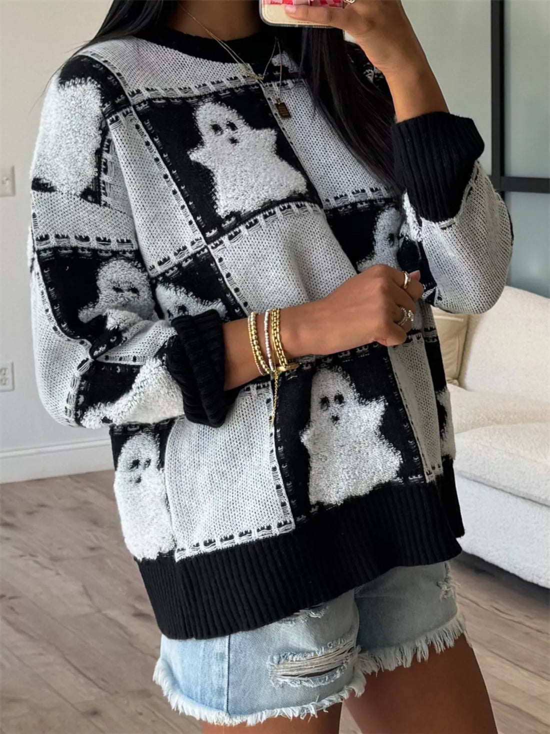 Black/white ghost checkered knit sweater with drop shoulders and ribbed neckline cuffs