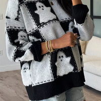 Black/white ghost checkered knit sweater with drop shoulders and ribbed neckline cuffs