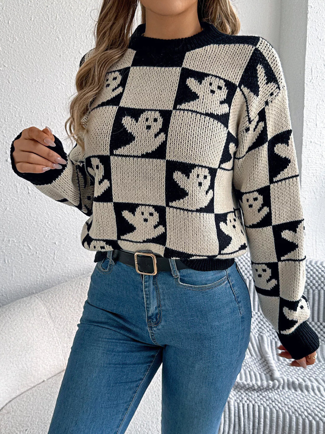 Ghost checkerboard knit sweater in black and cream with ribbed crew neck and cuffs