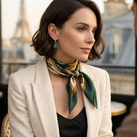 Emerald-green teardrop gemstone drop earring on gold hook, side view