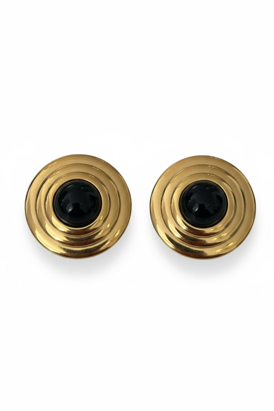 Gold round stud earrings with layered spiral design and black onyx center.