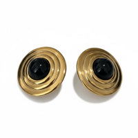 Gold spiral round stud earrings with black onyx cabochon center.