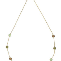 Gold chain necklace with evenly spaced oval green beads and brown discs