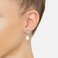 Silver-tone clover cz stud with pearl drop earring, side view on ear